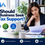 Small business owner reviewing sales tax records, filing deadlines, and compliance documents